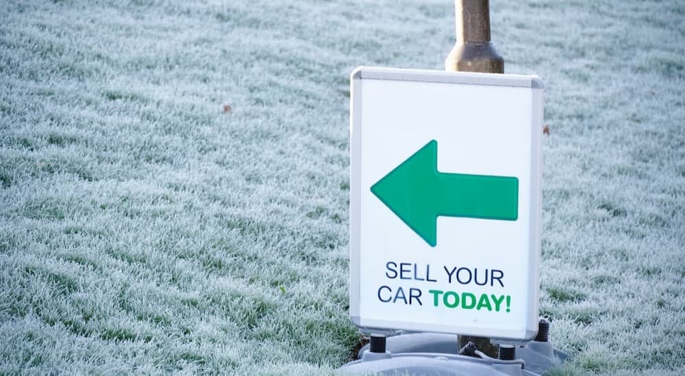 A "sell your car today sign."