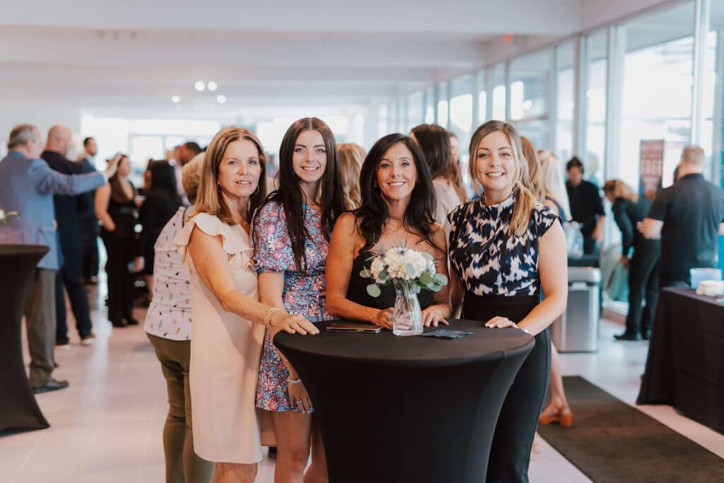image of a group of women standing at a table