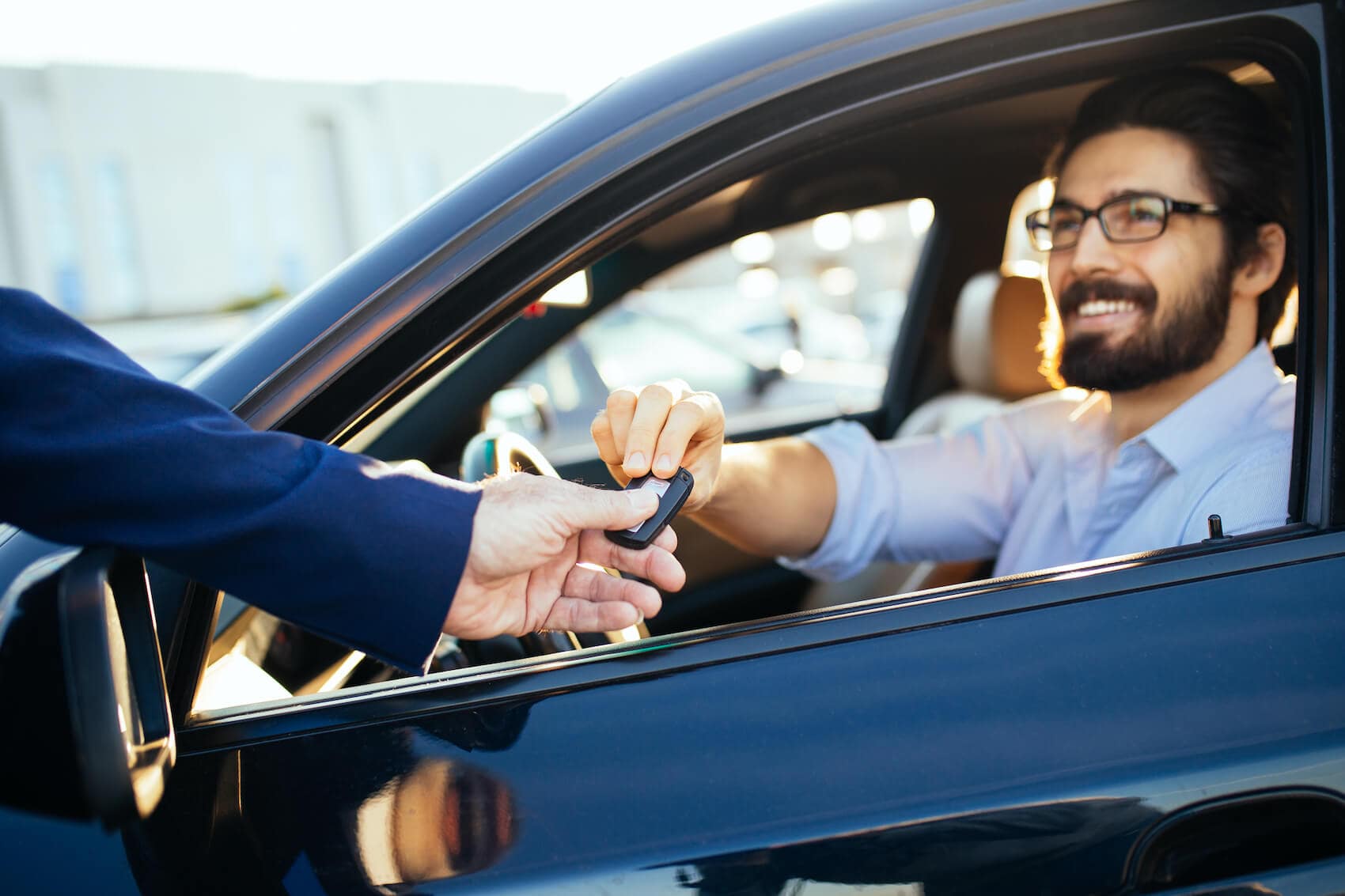 image of a man being handed a car key