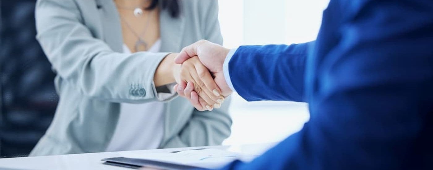 Two people shaking hands.